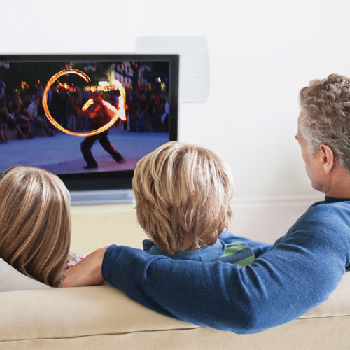 FlatWave Amped Pro Smart Amplified Indoor HDTV Antenna - Family in their living room watching TV