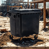 Black 1100 Litre Wheelie Bin on a Construction Site