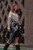 Lifestyle image of woman walking outside wearing the Saint-James Modane Sailor Striped Long Sleeve Shirt 