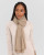 Alashan Cashmere 100% Cashmere Essential Scarf in Natural shown worn as a scarf 