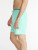 Side view of Chubbies Magic Apex Swimmer 7" Trunk in Teal Shark 