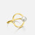 Patra Jordan Halo Pearl Ring features an imitation pearl in a smooth gold circle in Gold 