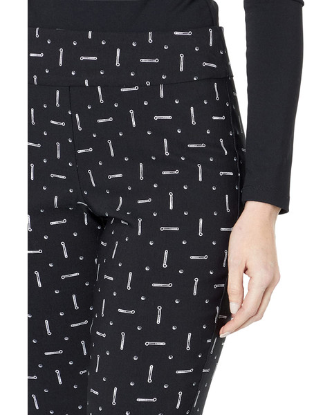 Close up view of the black golf print, small white golf clubs on top of a black background