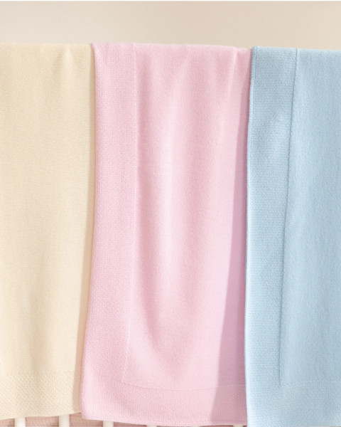 Alashan Cashmere Hayden Honeycomb Edge Baby Blanket shown in Snow, Beach Pink, and Skyline 