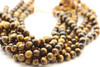 Tiger's Eye, Brown, Faceted Round in sizes 4mm, 6mm, 8mm & 10mm. Priced Per Strand