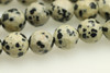 Dalmatian Stone "Jasper", Natural, Faceted Round. 8mm Strand
