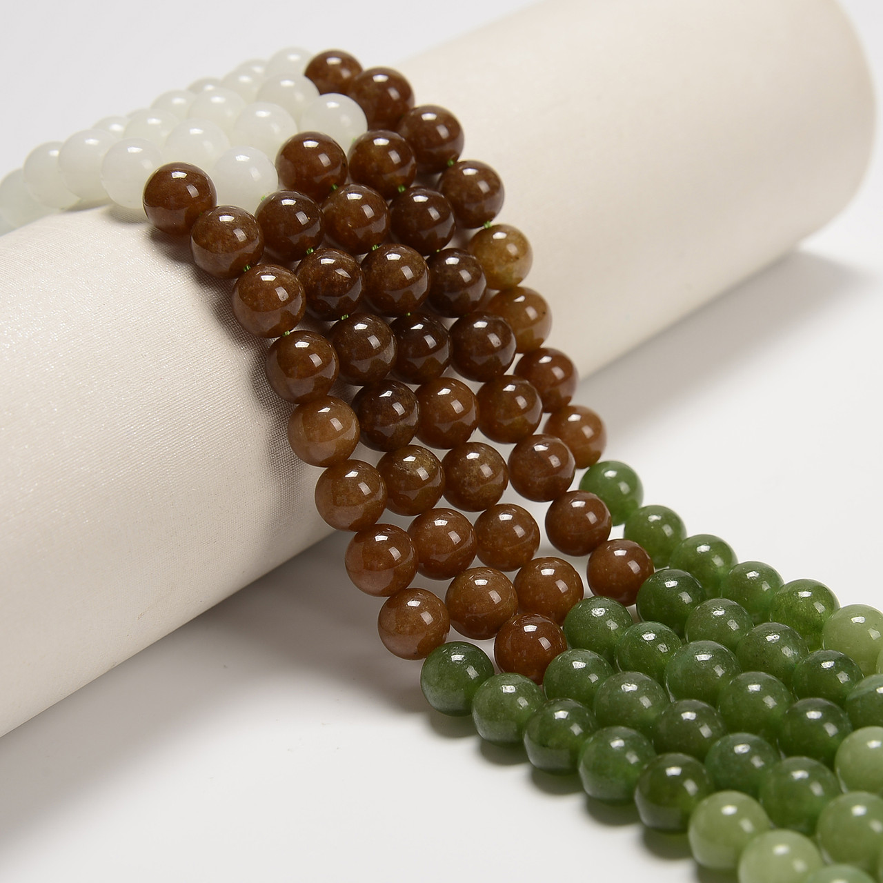 Jade, Hetian, Smooth Round in sizes 6mm, 8mm & 10mm. Priced Per Strand
