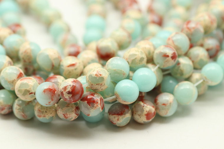Impression Jasper, Blue, Dyed, Smooth Round in sizes 4mm, 6mm, 8mm & 10mm. Priced Per Strand.