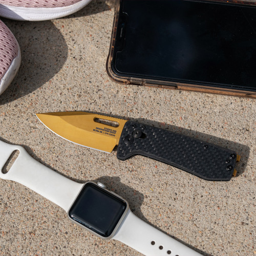 SOG Knives Ultra XR Gold - Ultralight EDC Knife - 2.8" S35VN Gold TiNi Blade, Carbon Fiber Handles, Titanium Money Clip SOG Knives Ultra XR Gold - Ultralight EDC Knife - 2.8" S35VN Gold TiNi Blade, Carbon Fiber Handles, Titanium Money Clip