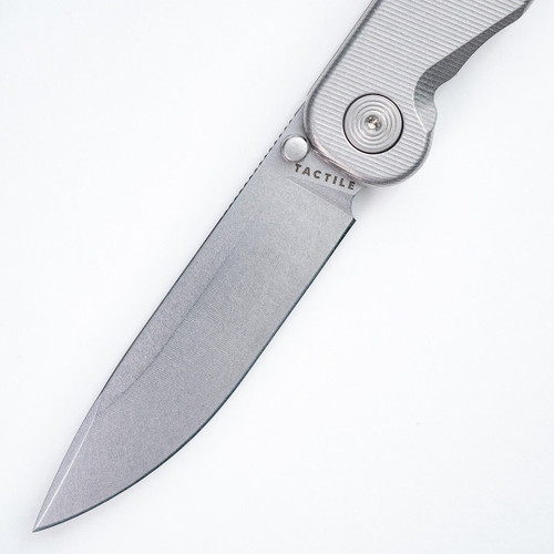 Tactile Knife Company Rockwall Thumb Stud Folding Knife - 3" MagnaCut Drop Point Blade, Machined Titanium Handles - 20-RT-MC01-TT01 Tactile Knife Company Rockwall Thumb Stud Folding Knife - 3" MagnaCut Drop Point Blade, Machined Titanium Handles - 20-RT-MC01-TT01