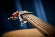 Using Capos Without Damaging Your Acoustic Guitar Strings