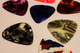 Comparing Guitar Pick Materials - Strings and Beyond