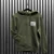 Oasis Unisex Pullover Hoodie: Live '25 Distressed Lockup Pocket (Khaki)