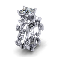Nature inspired engagement ring with a matching leaf vine wedding band