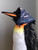 Keeping hair from flying in strong winds, Boreas demonstrates how this scarf can be worn on one's head.