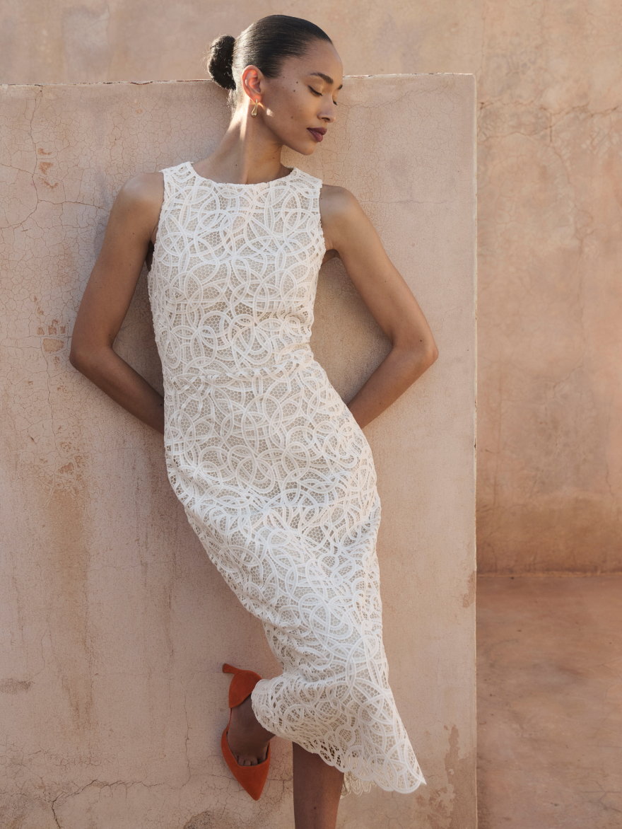 Model wearing Valencia ivory dress