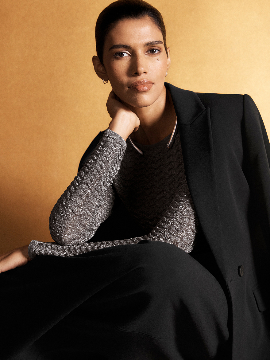 Model wearing black suiting