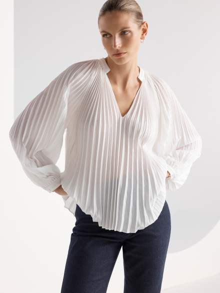 Model wearing white blouse