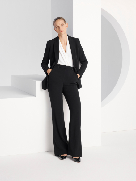 Model wearing black Clever Crepe tailoring