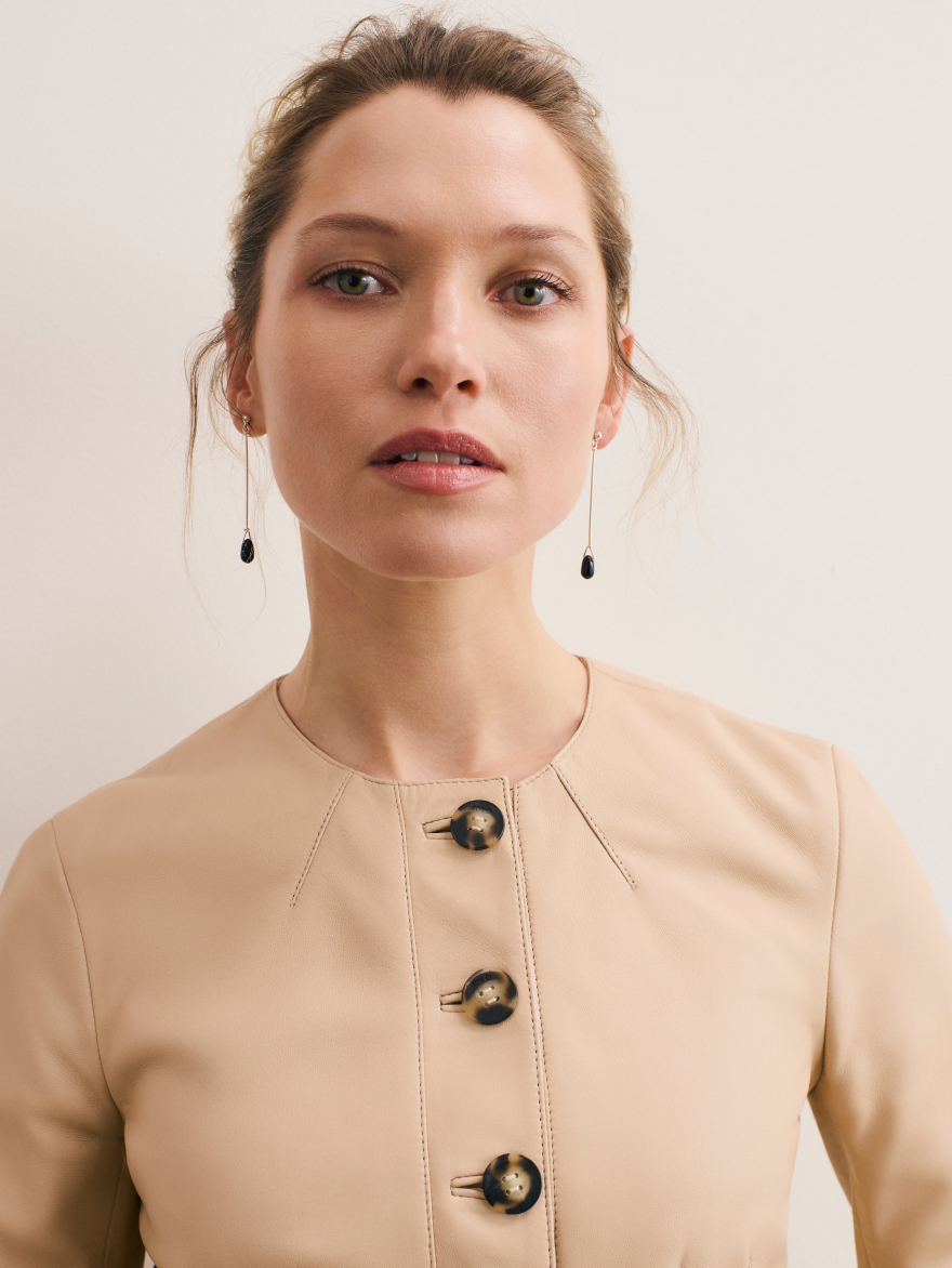 Model wearing stone Ginevra jacket