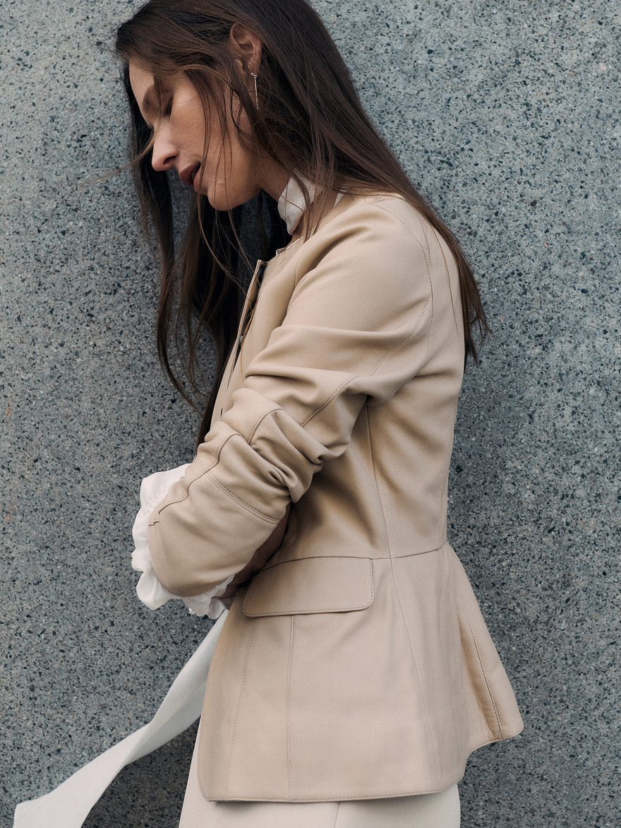 Model wearing stone Ginevra jacket