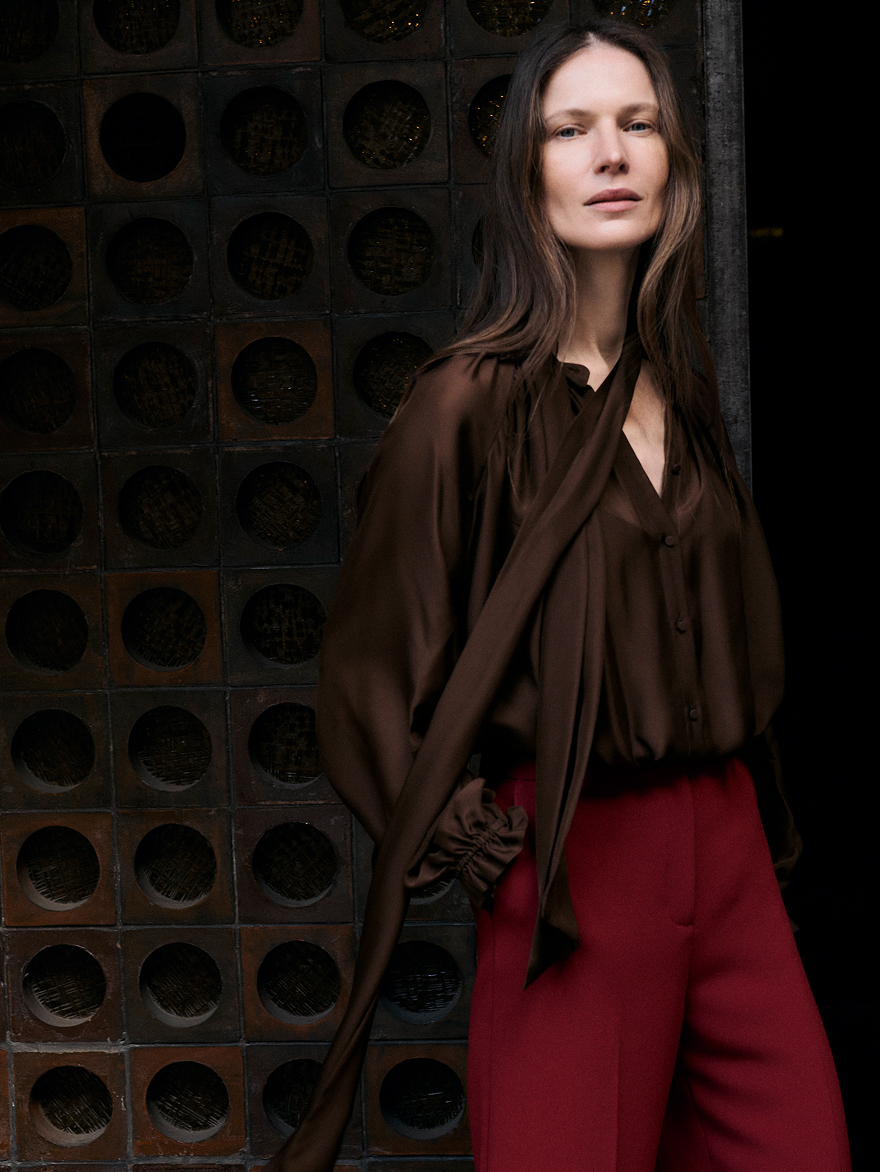 Model wearing chocolate blouse