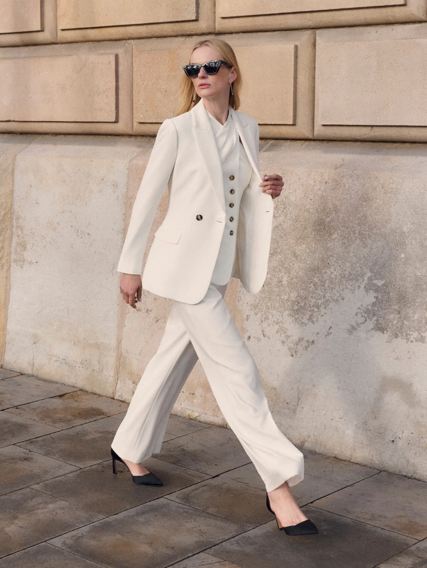 Model wearing stone Ginevra jacket