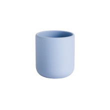 A clearcut image of the Nestling Silicone Training Open Baby Cup in the colour Dusty Blue.