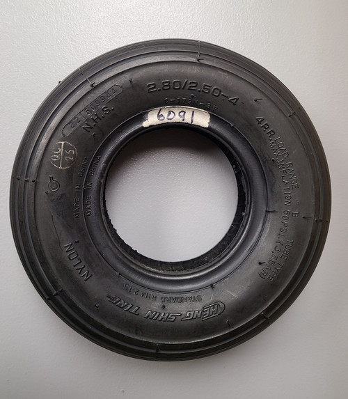 Ribbed black tire.