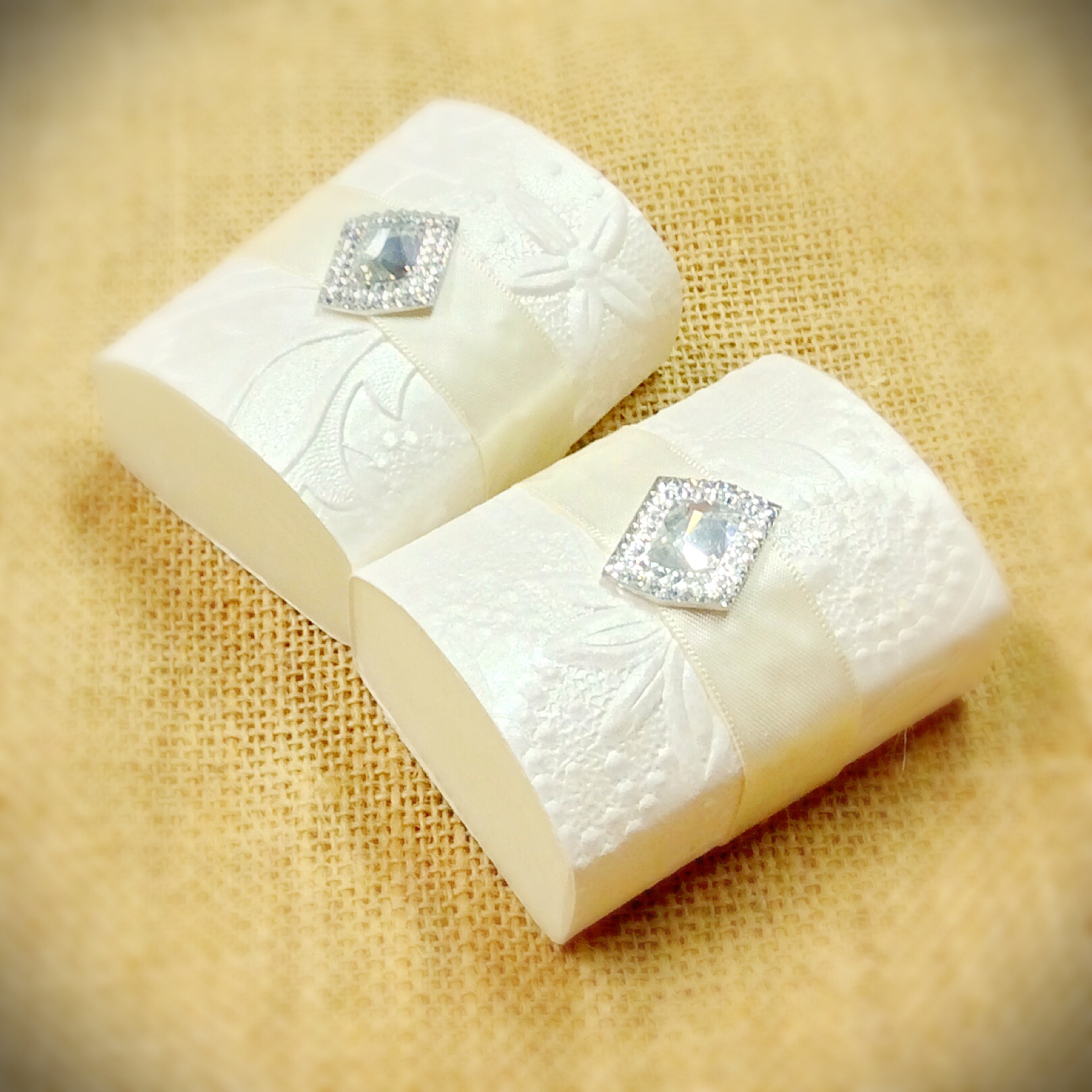 wedding-or-event-favor-of-1-large-goats-milk-soap-with-embossed-paper-and-embellishment-on-top.jpg