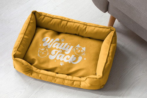 Yellow cat bed with Wally Jack logo