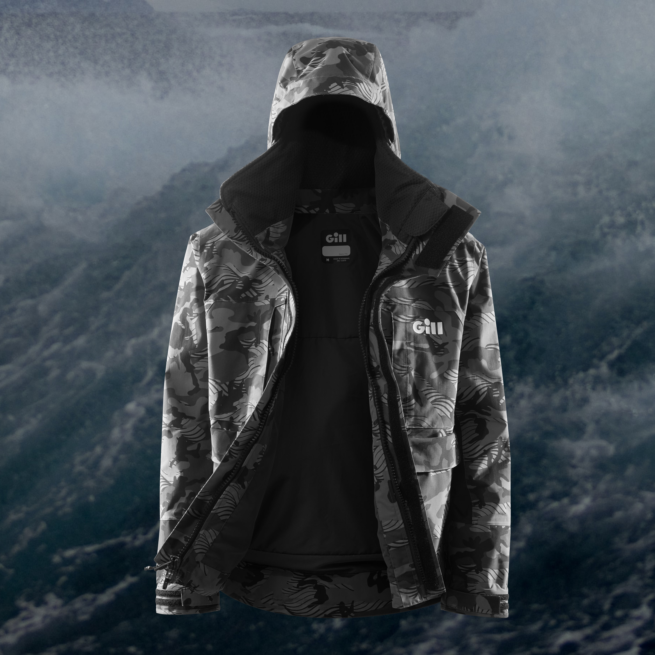 A Gill Fishing Meridian-X Jacket, open on a water background