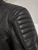 VENTI ACE LEATHER JACKET BLACK, close-up of black leather motorcycle jacket showing padded shoulder and perforated leather detail.
