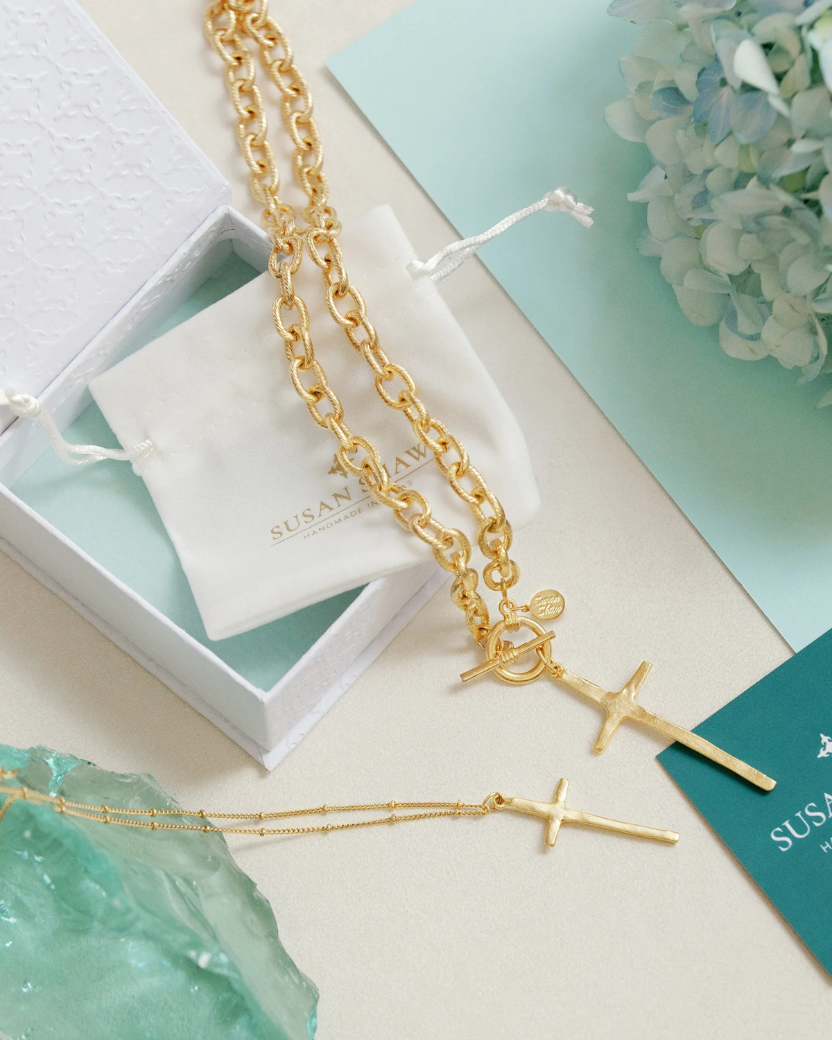 Susan Shaw gold cross necklaces.