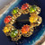 Vintage Gold Tone Prong Set Made in Austria Green Red Yellow Crystal Brooch Pin