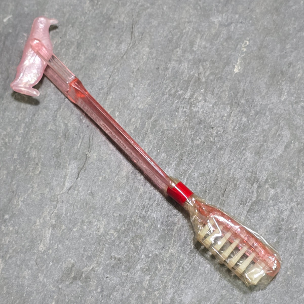 DuPont Dentabest NOS Vintage Pink Children's Toothbrush with Spinning Penguin