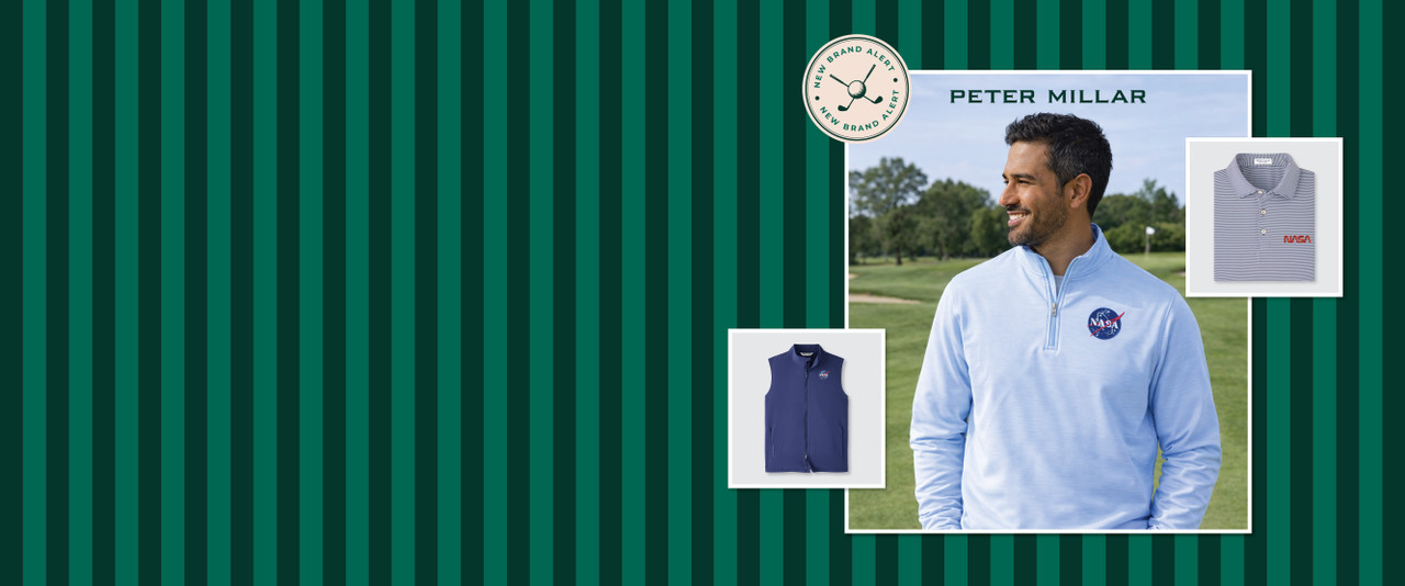 Man in a blue NASA meatball 3/4 zip pullover on a golf course.