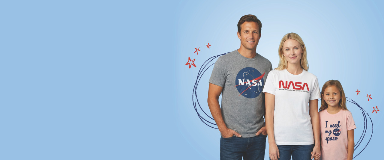 Man in a NASA meatball logo shirt, woman in a NASA worm logo shirt, and girl in an I Need My Space shirt.