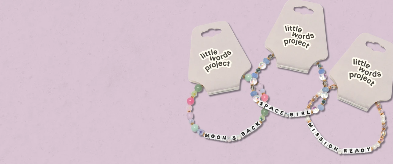 3 bracelets on a light purple background that say Moon & Back, Space Girl, Mission Ready