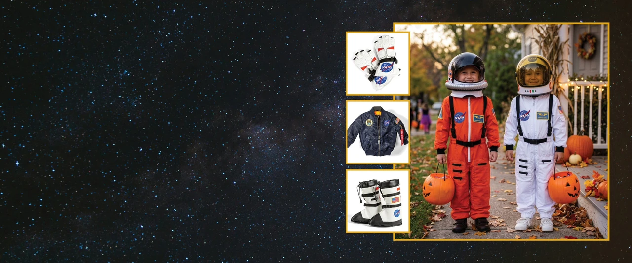Little boys in orange and white astronaut suits with astronaut gloves, flight jacket, and boots to the left all on a dark starfield background.
