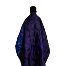 Person Wrapped In NASA Space Journey Blanket
