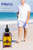 Image of a man walking by the beach and the products bottle