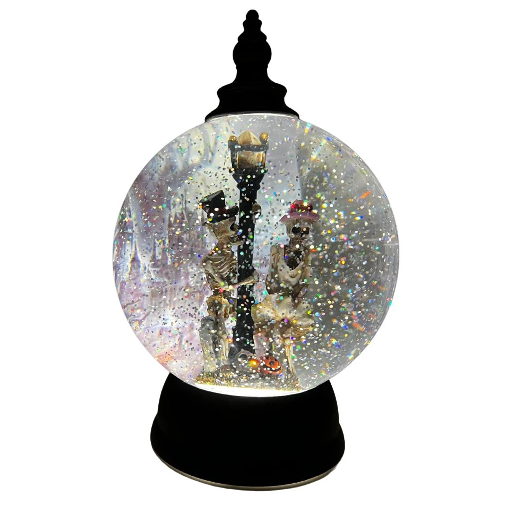 Shimmering Halloween Themed Light-Up Water Globe With Skeletons