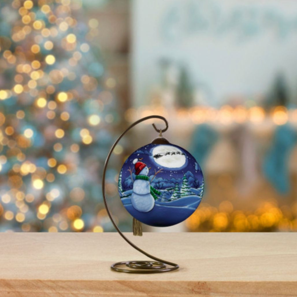 Ne’Qwa Art Snowman Watching Santa Fly Over Moon Glass Ornament – 2.5 Inch