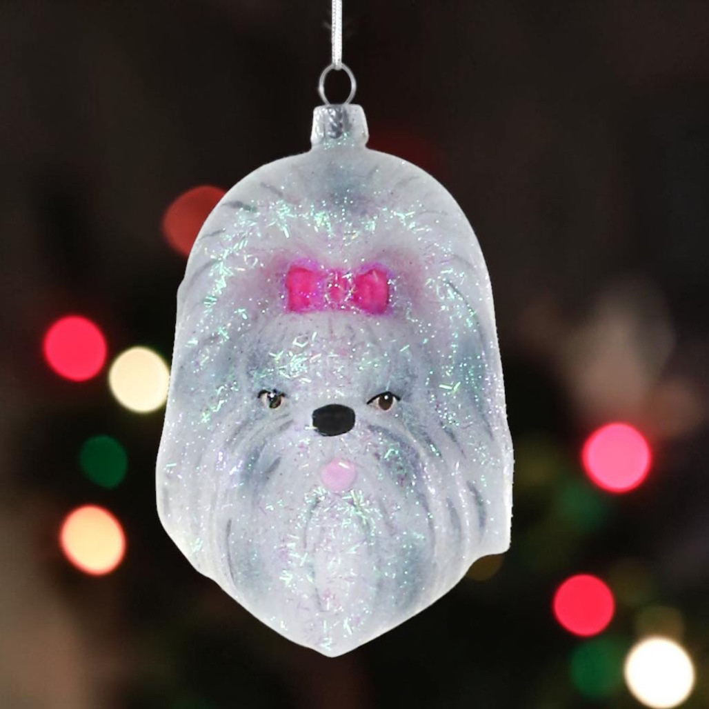 Glass Shih Tzu Christmas ornament with white fur and pink bow.
Pampered dog ornament with glitter accents and hanging cord.
White Shih Tzu face ornament for pet lover Christmas decorating.