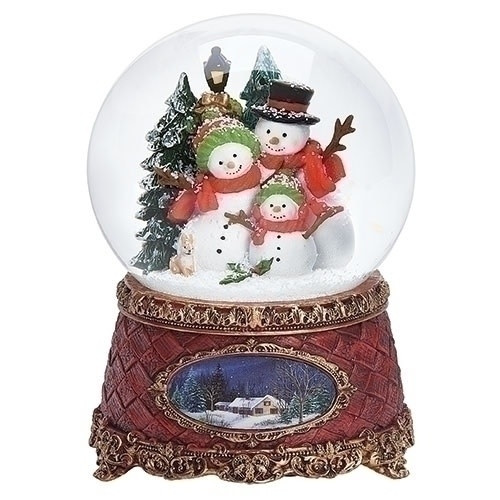 5.75 "H Musical Wind Up Snow Globe Snowman Family Sitting On An Antique Red Base That Plays 'We Wish You A Merry Christmas'
