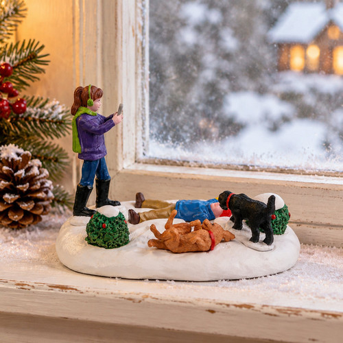 Lemax Snow Angels Best Friend – collectible Christmas village piece displayed in a cosy home