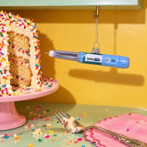 Cody Foster Weight Loss Injection Pen Ornament – glass Christmas ornament styled in a fun, eclectic home scene
