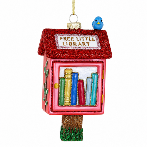 Cody Foster Free Little Library glass ornament with pink box, red glitter roof, books, and blue bird.
Five-inch glass ornament shaped like a neighborhood Free Little Library with colorful book details.
Book-themed Christmas ornament hanging from a gold cord with glitter accents and library sign.