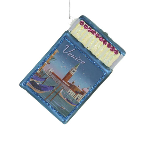 Glass Venice souvenir matchbox ornament with blue frame and canal artwork.
Italy travel Christmas ornament with Venice text, gondolas, and glittered match details.
3 inch glass matchbox ornament with decorative matches and silver hanging cord.